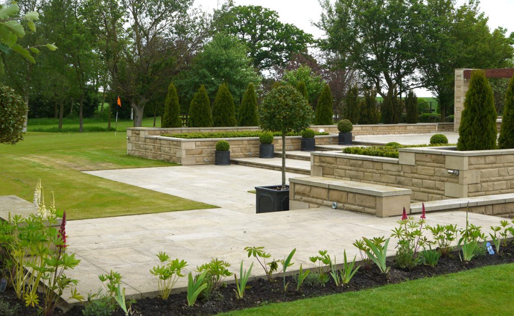 landscape design, landscape gardening, landscapers, gardeners, creative design, Teesside, patios, paving, sandstone, pots, Holly, garden walls, raised patio area, pergola, turfing, borders, plants, soft landscaping, hard landscaping, Green Onion Landscaping,