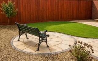 Circular Yorkstone patio with curved lawn and decorative gravel in Nunthorpe, Middlesbrough
