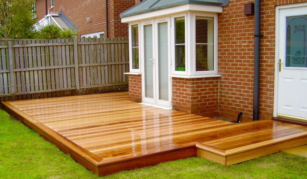 Cedar wood decking area in Middleton St George, Darlington, County Durham by Green Onion Landscaping