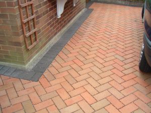 Herringbone pattern permeable, block paving in Fairfield, Stockton. Installed by Green Onion Landscaping 