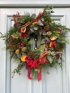 Beautiful, fresh, traditional Christmas door wreath with red bow made by Green Onion Landscaping in Stockton on tees. For sale. 