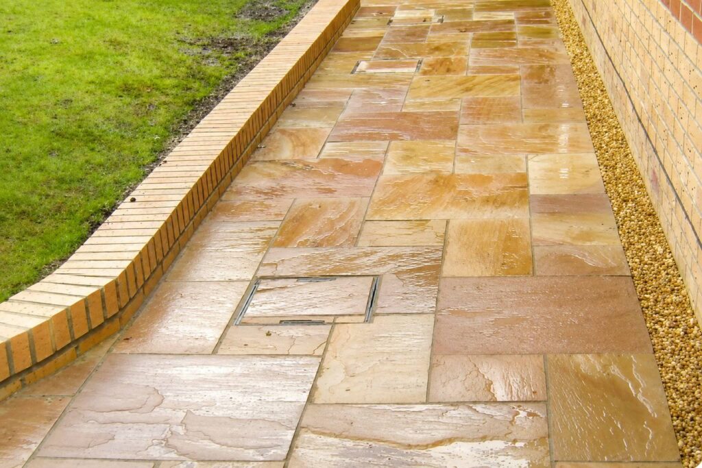 Indian sandstone garden pathway with brick edging in Marton Middlesbrough